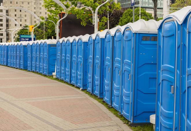 a row of portable restrooms at a fairground, offering visitors a clean and hassle-free experience in riverdale